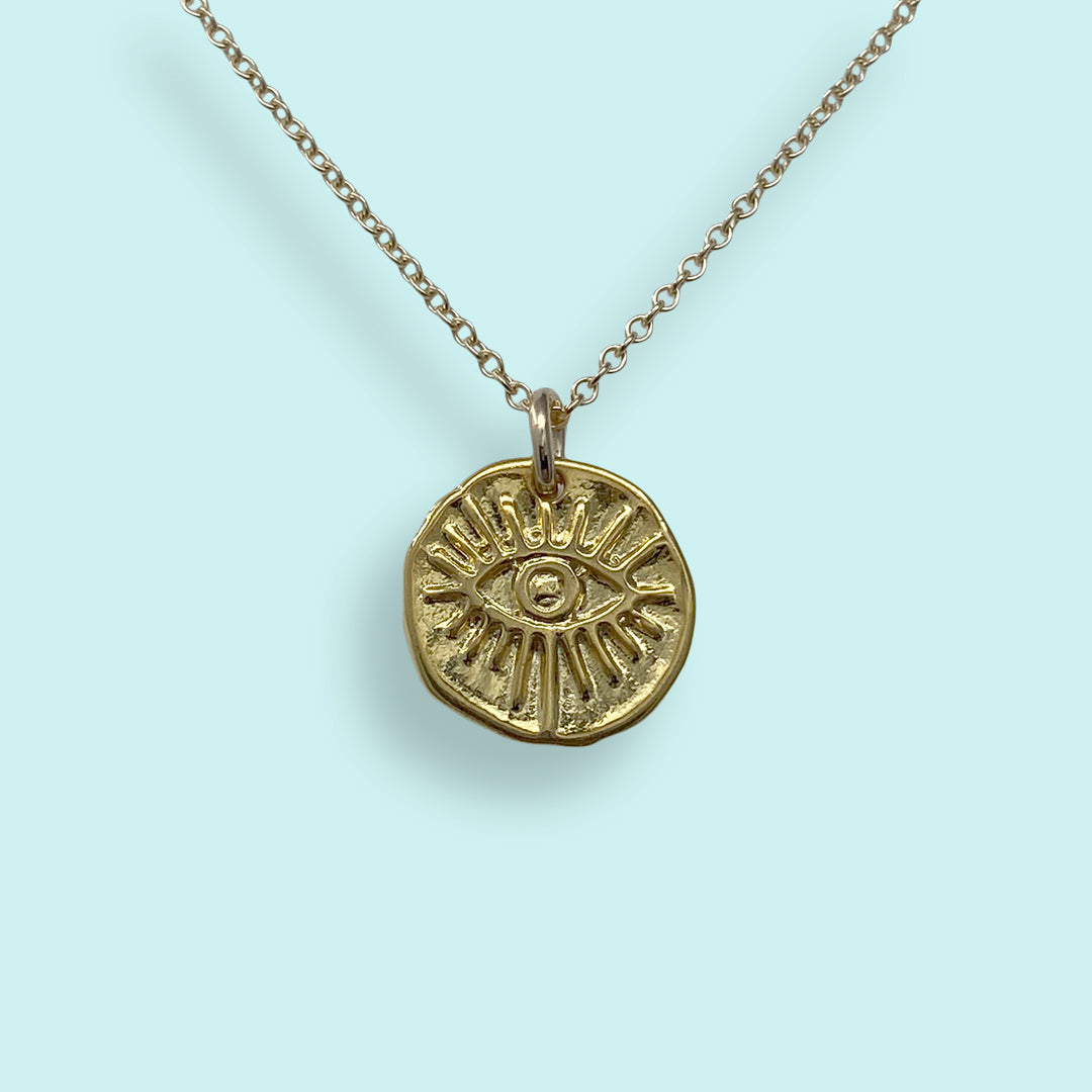 Evil eye medallion hotsell