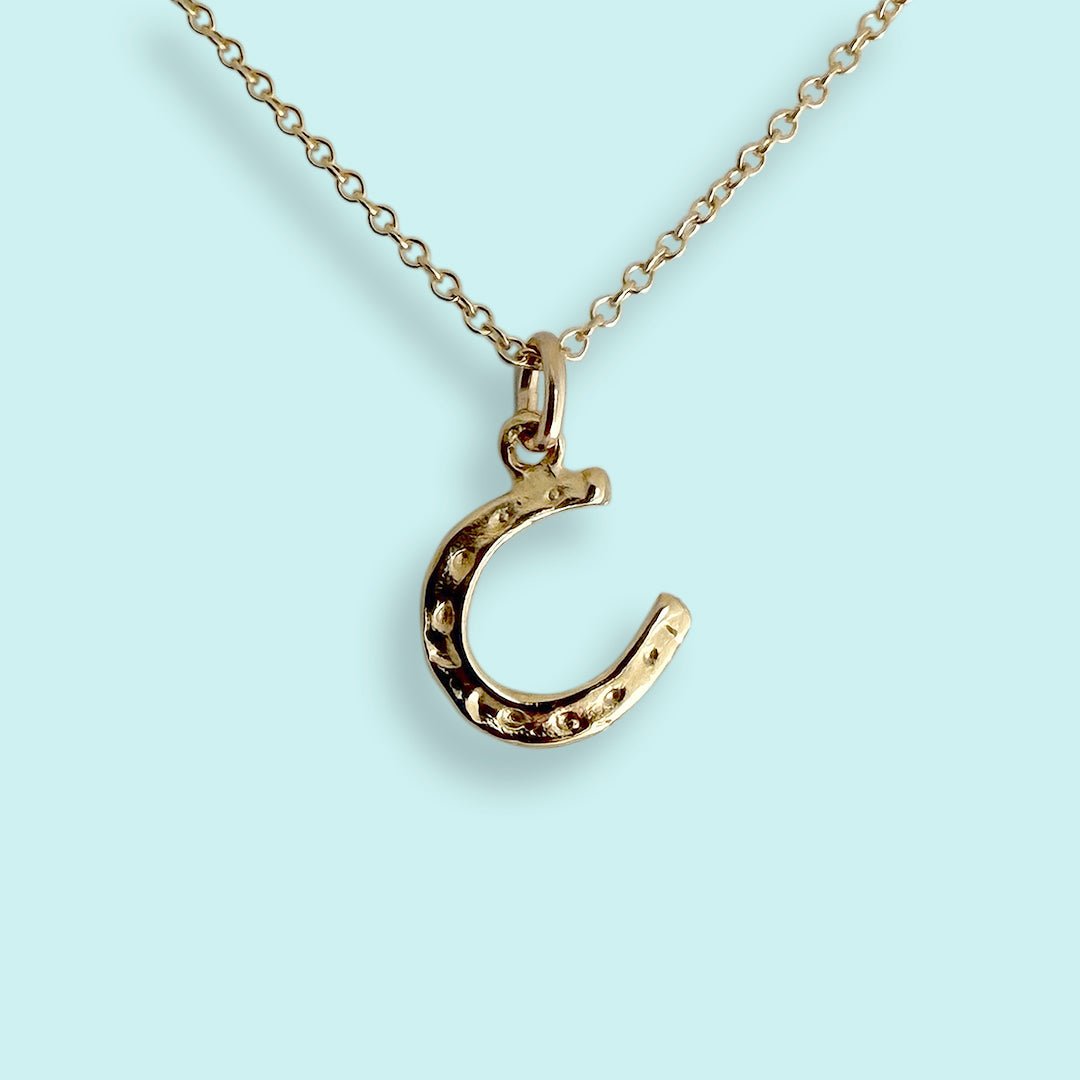 Tiny Gold Horseshoe Necklace | Symbol of Good Luck by Ornamental