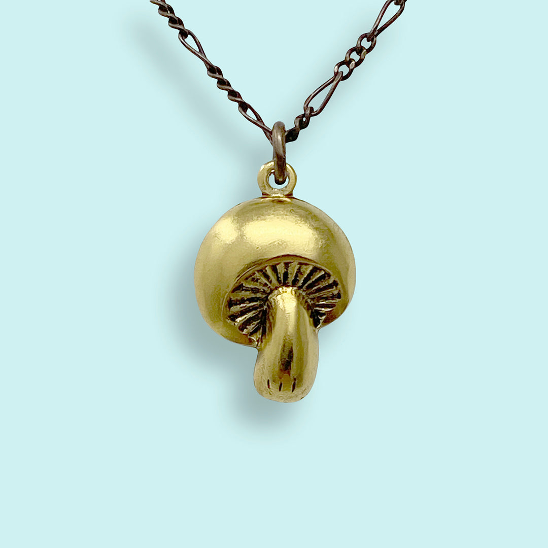 Mushroom Pendant Necklace in solid silver with rose gold detail.